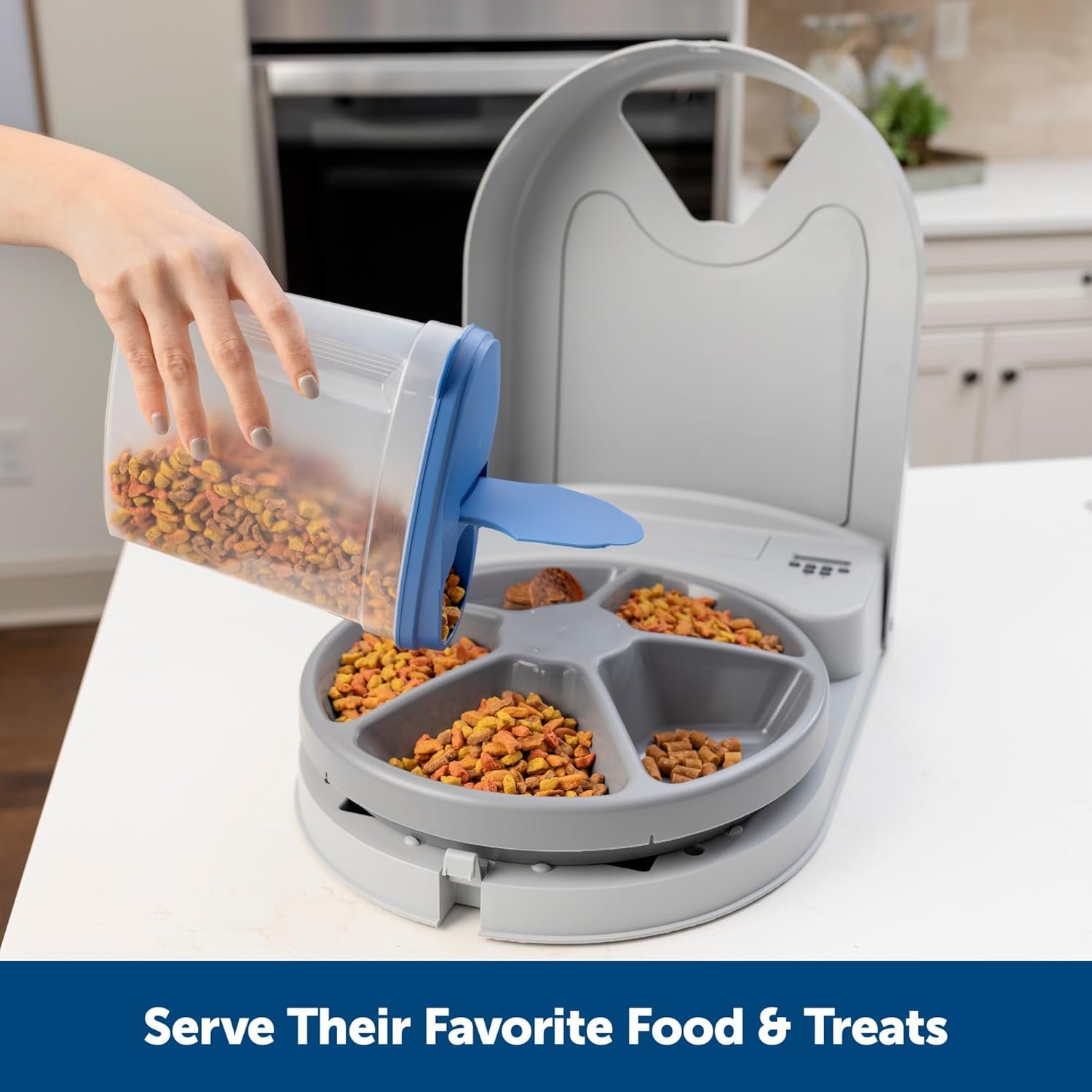 1. A person is opening a food dispenser to access a bowl filled with food, ready to serve a meal.